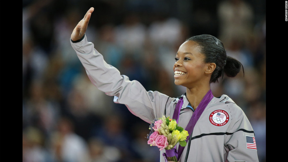 U.S. gymnast Gabrielle Douglas celebrates on the podium after winning the gymnastics women&#39;s individual all-around final on Thursday.