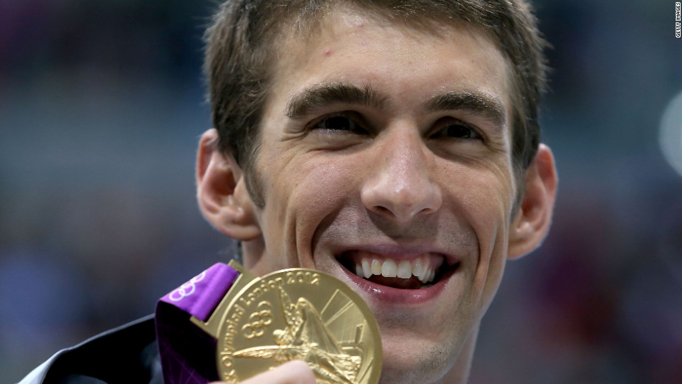 Phelps shows off his gold medal from the 200-meter medley at the London Olympics. It was his 20th career medal.