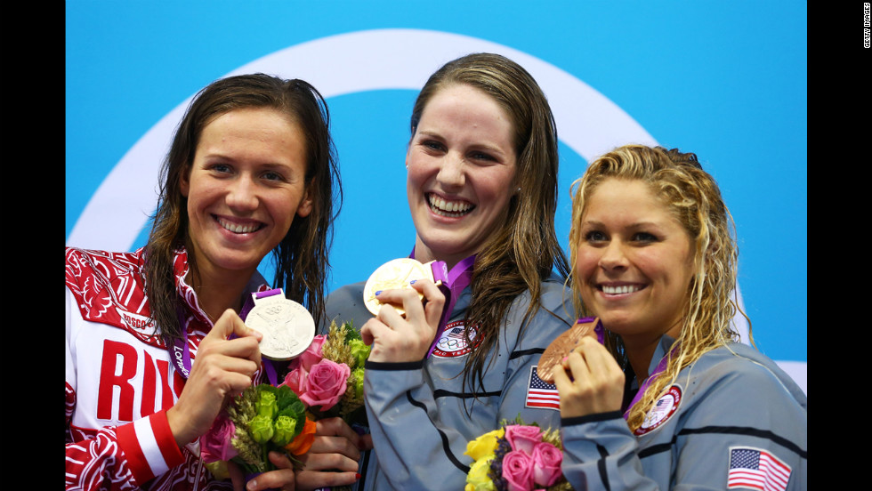 Left to right: Silver medalist Anastasia Zueva of Russia, gold medalist Missy Franklin of the United States and bronze medalist Elizabeth Beisel of the United States on the podium during the medal ceremony for the women&#39;s 200-meter backstroke final on Day 7 of the London 2012 Olympic Games.