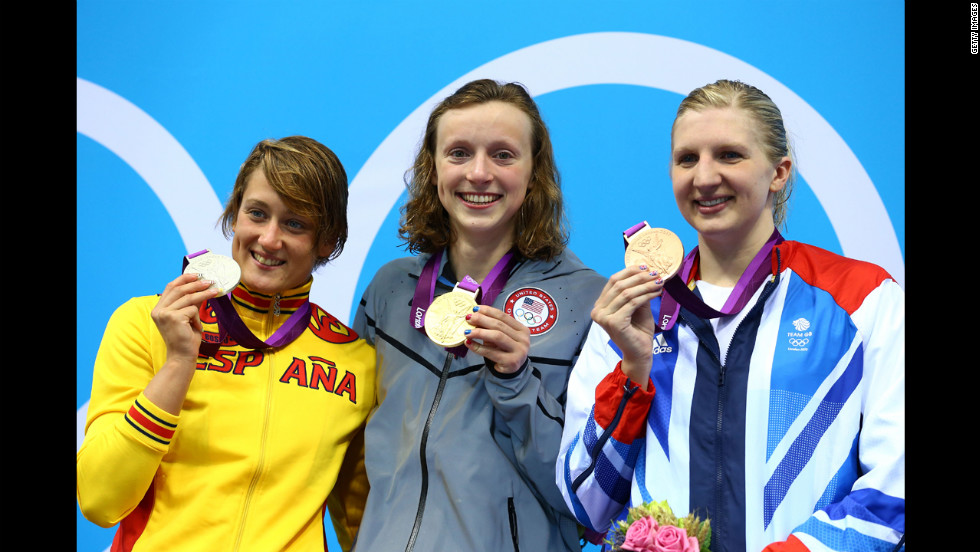 Left to right: Silver medallist Mireia Belmonte Garcia of Spain, gold medalist Katie Ledecky of the United States and bronze medalist Rebecca Adlington of Great Britain on the podium during the medal ceremony for the women&#39;s 800-meter freestyle final on day 7 of the London 2012 Olympic Games.