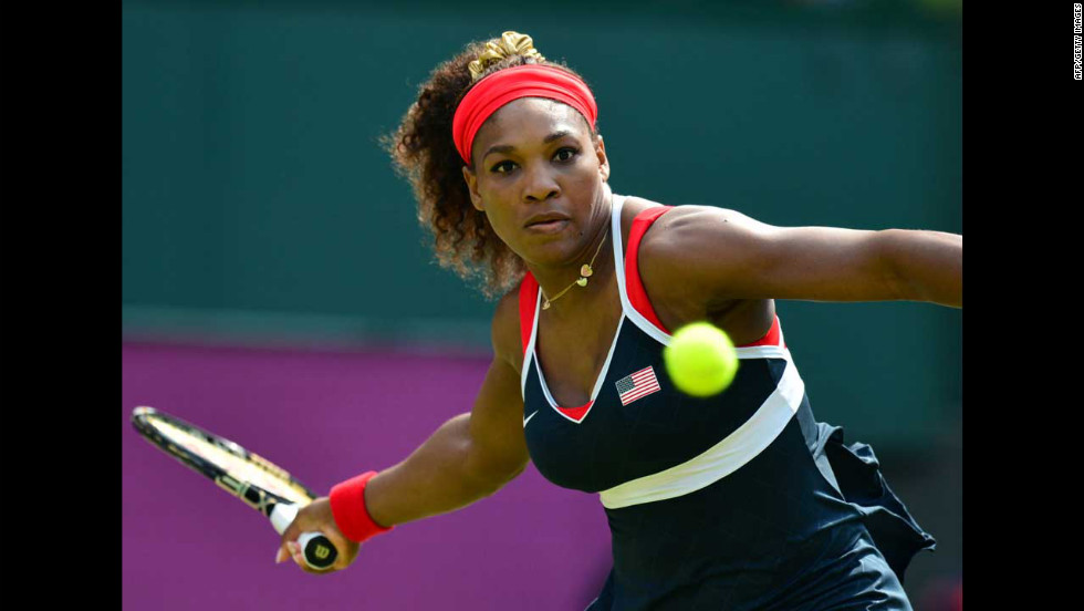 Serena Williams hits a return to Russia&#39;s Maria Sharapova during the women&#39;s singles tennis final.