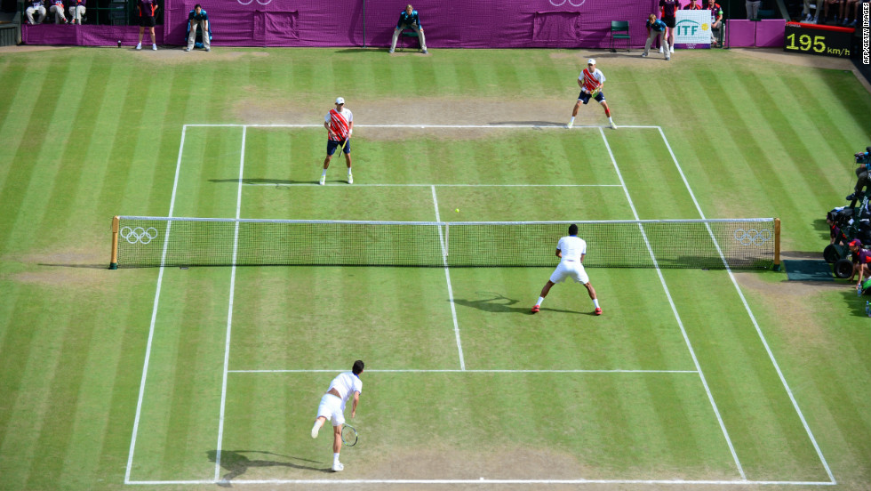 France&#39;s Michael Llodra and Jo-Wilfried Tsonga compete against Mike Bryan and Bob Bryan of the United States in the men&#39;s doubles final.