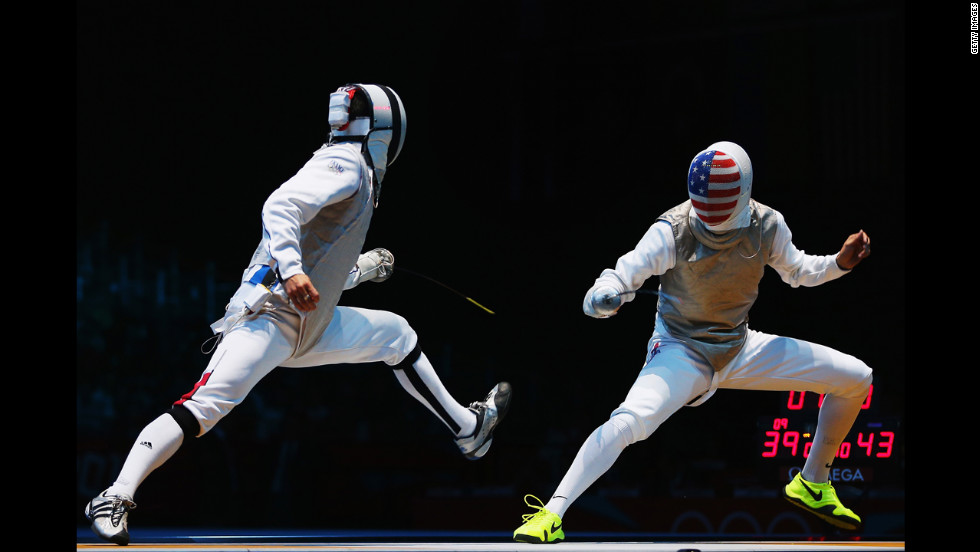 Erwan Le Pechoux of France faces off against Alexander Massialas of the United States during the men&#39;s foil team fencing quarterfinal.