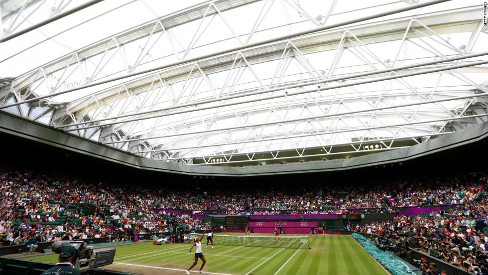 Serena and Venus Williams serve the ball to Andrea Hlavackova and Lucie Hradecka of the Czech Republic during the women&#39;s doubles final. The Williams sisters went on to win the gold medal, which they also won at the 2008 Olympics.