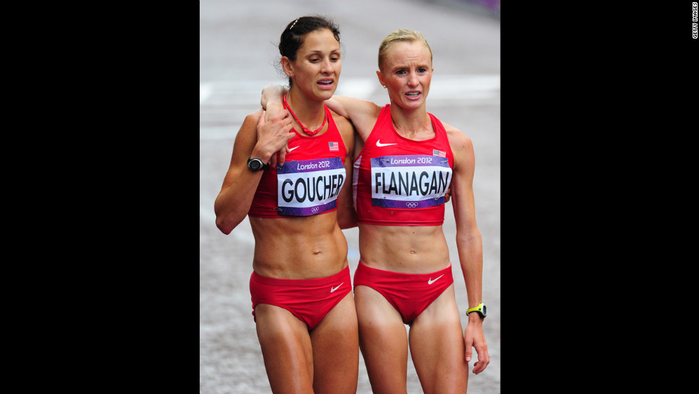 Kara Goucher, left, and Shalane Flanagan of the United States support each other after completing the women&#39;s marathon.