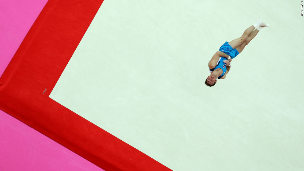 Enrique Tomas Gonzalez Sepulveda of Chile soars above the floor during the artistic gymnastics men&#39;s floor exercise final.