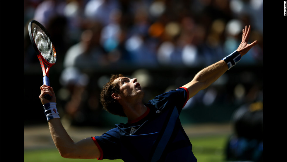 Andy Murray of Great Britain serves the ball to Roger Federer of Switzerland during the men&#39;s singles tennis gold medal match. Murrary went on to win the match.