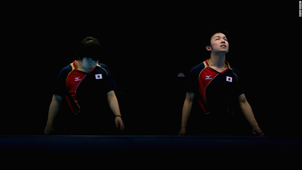 Seiya Kishikawa and Koki Niwa of Japan compose themselves during their men&#39;s team table tennis quarterfinal match against the team from Hong Kong.