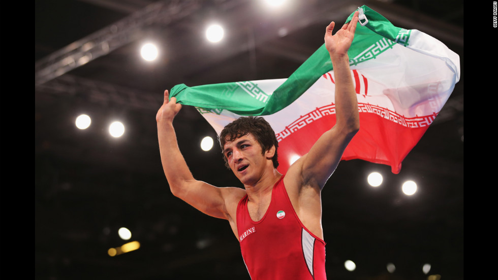 Hamid Mohammad Soryan Reihanpour of Iran celebrates winning the gold medal in the men&#39;s Greco-Roman 55 kilogram wrestling bout.