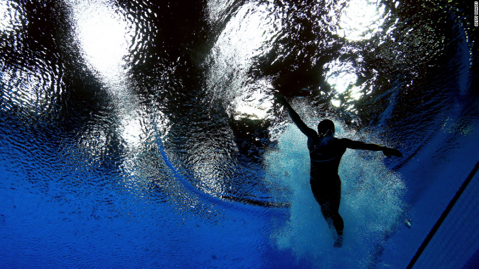 Cassidy Krug of the United States swims after her dive in the women&#39;s 3-meter springboard diving final.