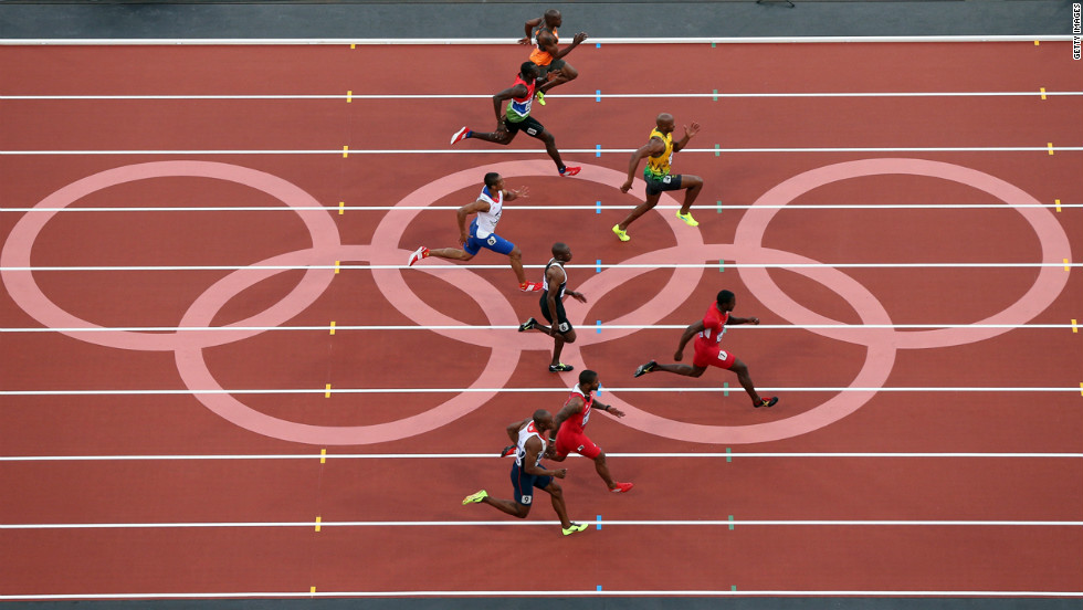 Asafa Powell of Jamaica and Justin Gatlin of the United States lead the pack in the men&#39;s 100-meter semifinal.