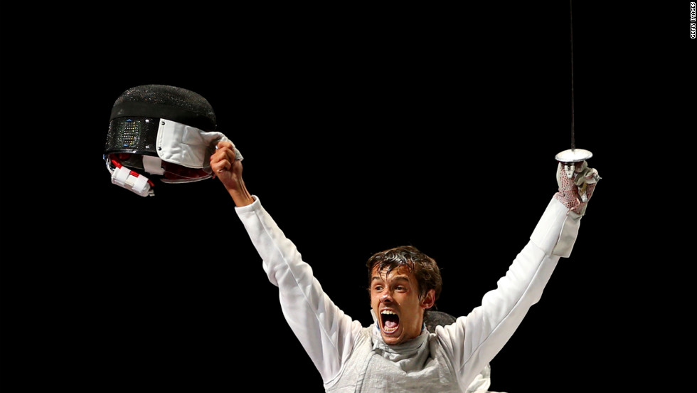 Andrea Baldini of Italy is joyous after defeating Kenta Chida of Japan to win the gold medal in the men&#39;s foil team fencing.