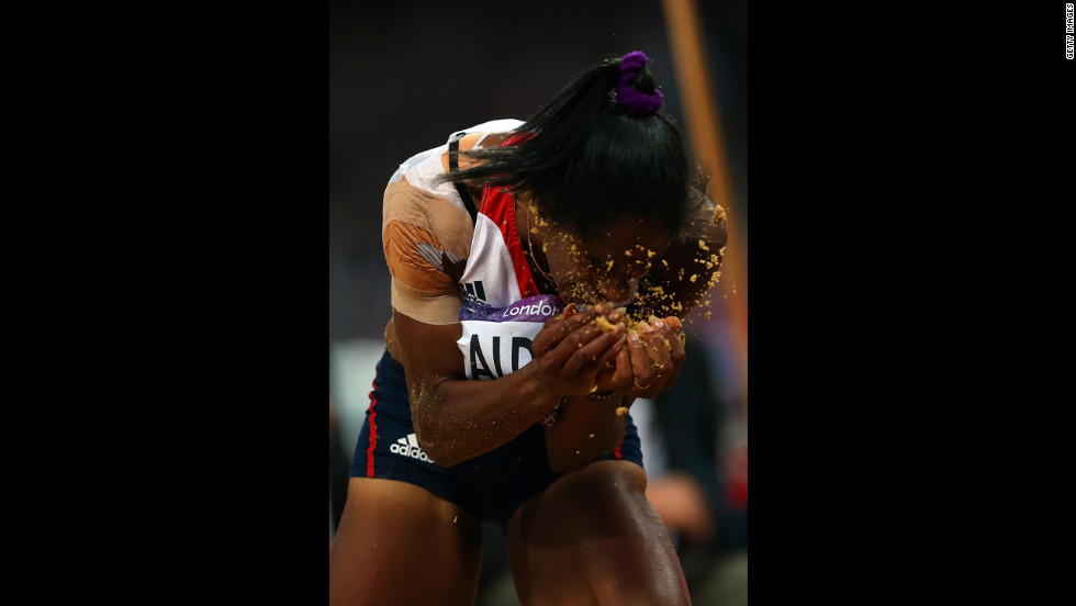 Yamile Aldama of Great Britain reacts after completing her jump in the women&#39;s triple jump final.