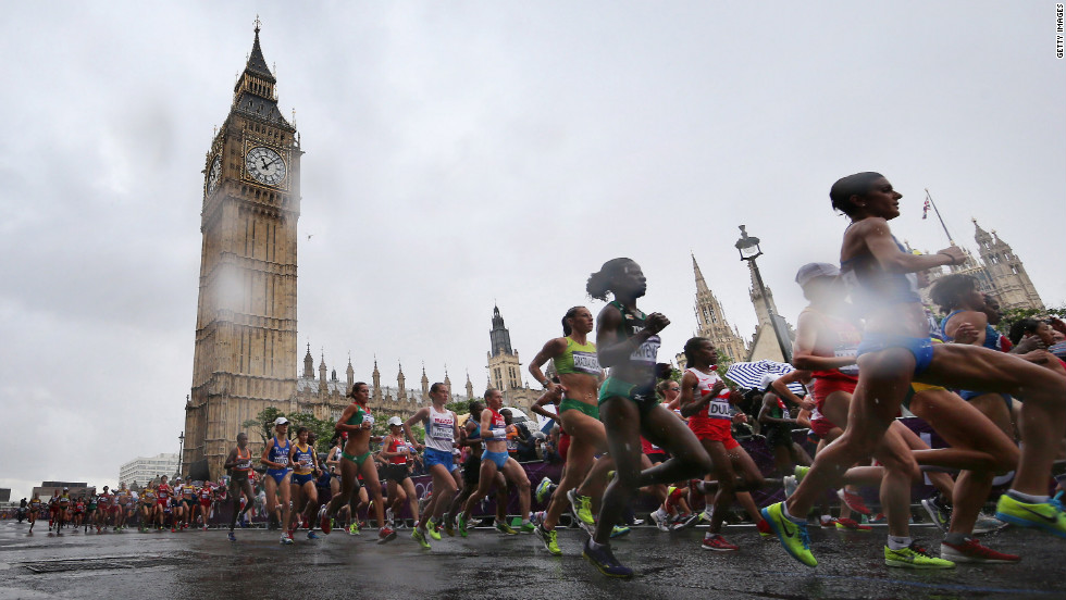 Competitors take part in the women&#39;s marathon event as rain falls on Day 9 of the London 2012 Olympics.