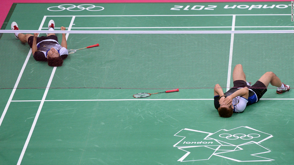 South Korea&#39;s Lee Yong Dae, left, and Chung Jae Sung celebrate their victory over the Malaysian team during the bronze medal men&#39;s doubles badminton match.