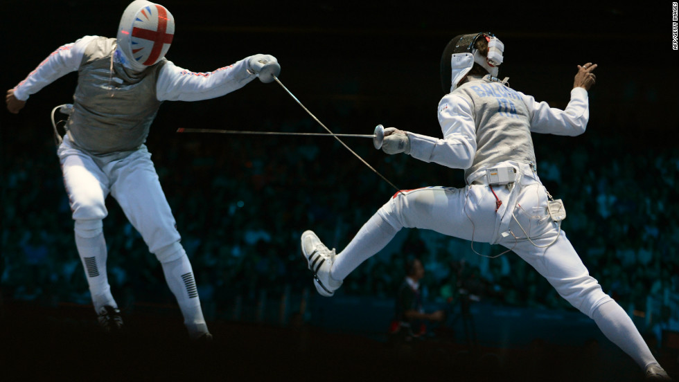 Britain&#39;s James Davis, left, fences against Italy&#39;s Andrea Baldini during the men&#39;s foil team quarterfinals.