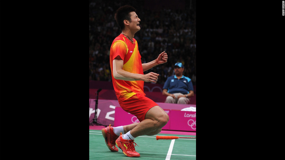 Long Chen of China celebrates winning the bronze medal in the men&#39;s singles badminton event, beating Hyun Il Lee of South Korea.