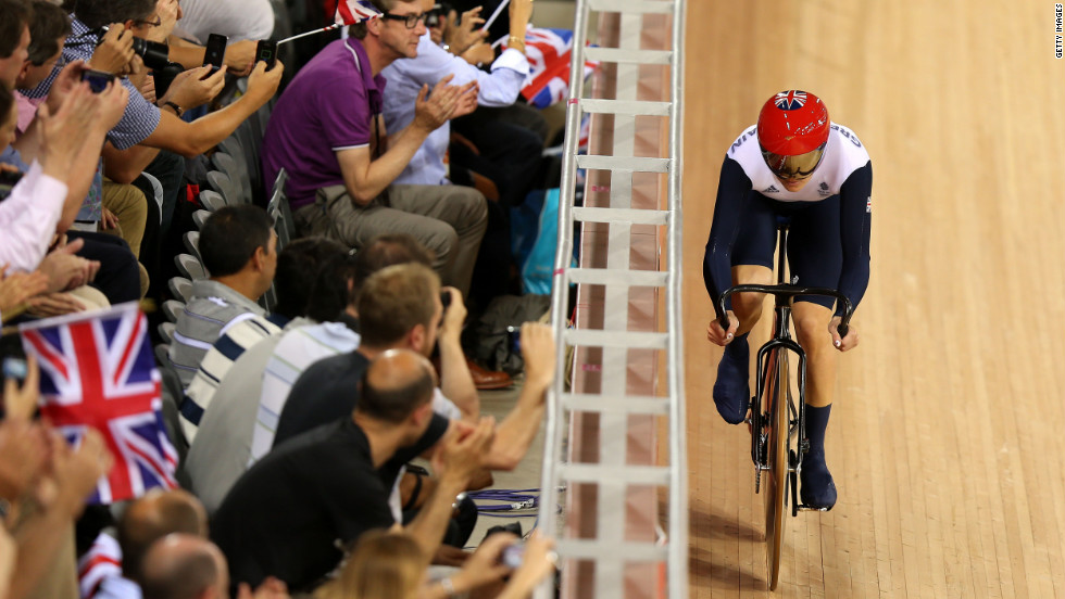 Spectators cheer on Victoria Pendleton of Great Britain during a women&#39;s sprint track cycling qualifier.