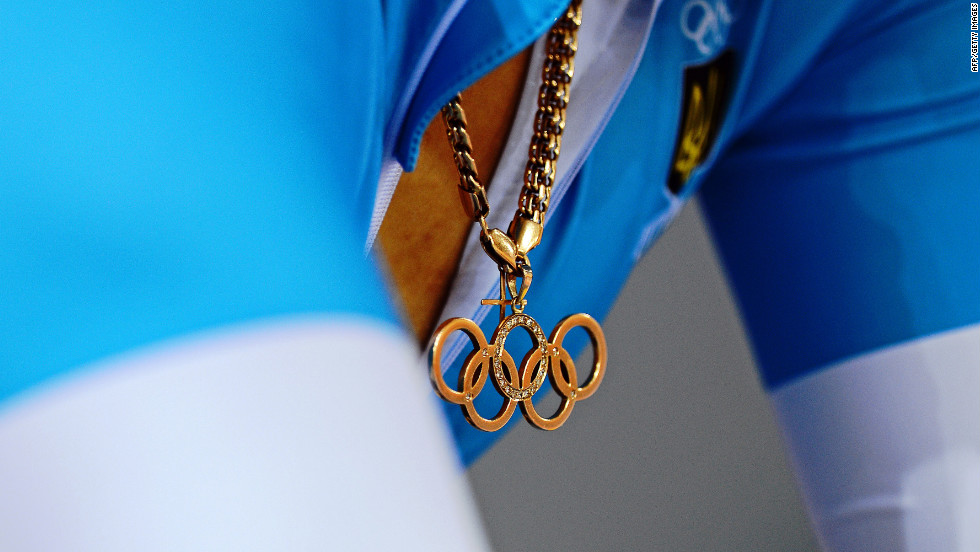 Lyubov Sulika of Ukraine wears an Olympic rings pendant as she prepares for a women&#39;s sprint qualifying track cycling event.