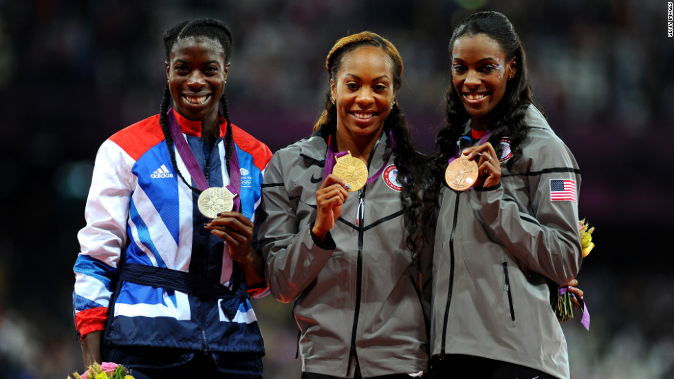 From left, silver medalist Christine Ohuruogu of Great Britain, gold medalist Richards-Ross and bronze medalist DeeDee Trotter of the United States show off their medals during Sunday&#39;s ceremony at Olympic Stadium in London.