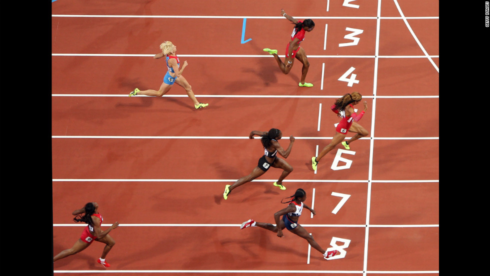 Richards-Ross crosses the line to win the gold.