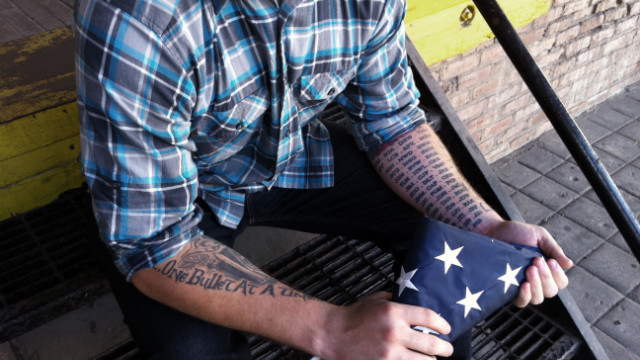 Robert Kyle has tattoos of friends&#39; initials who were killed while deployed. He now works as a peer coach at Vets Prevail. 