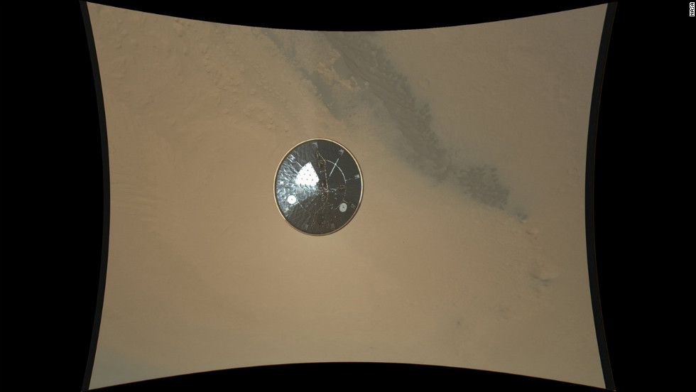 This color full-resolution image showing the heat shield of NASA&#39;s Curiosity rover was obtained during descent to the surface of Mars on August 13, 2012. The image was obtained by the Mars Descent Imager instrument known as MARDI and shows the 15-foot diameter heat shield when it was about 50 feet from the spacecraft. 