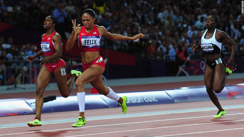 Allyson Felix of the United States crosses the finish line ahead of Murielle Ahoure of Cote d&#39;Ivoire and Carmelita Jeter of the United States to win the women&#39;s 200-meter final on Wednesday.