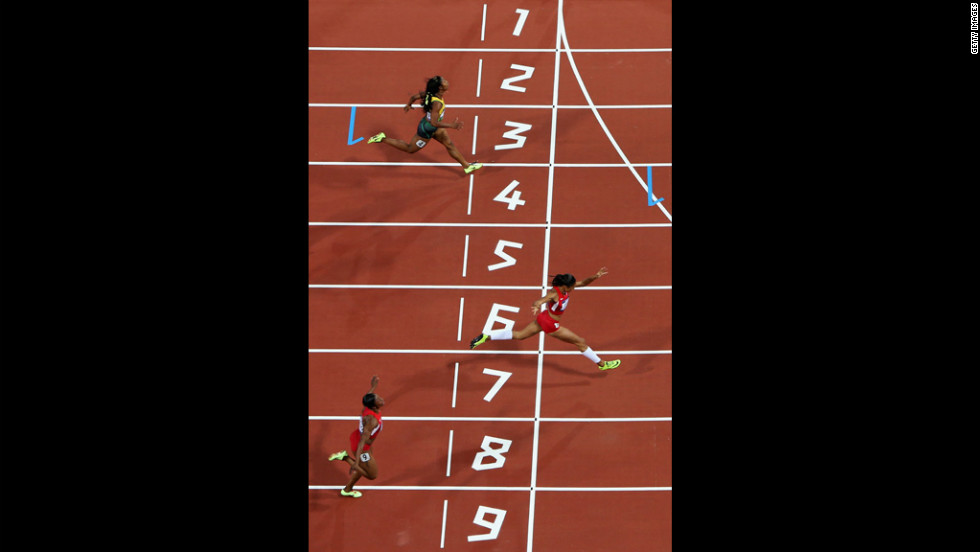 Allyson Felix of the United States crosses the finish line ahead of Murielle Ahoure of Cote d&#39;Ivoire and Carmelita Jeter of the United States to win the women&#39;s 200-meter final.