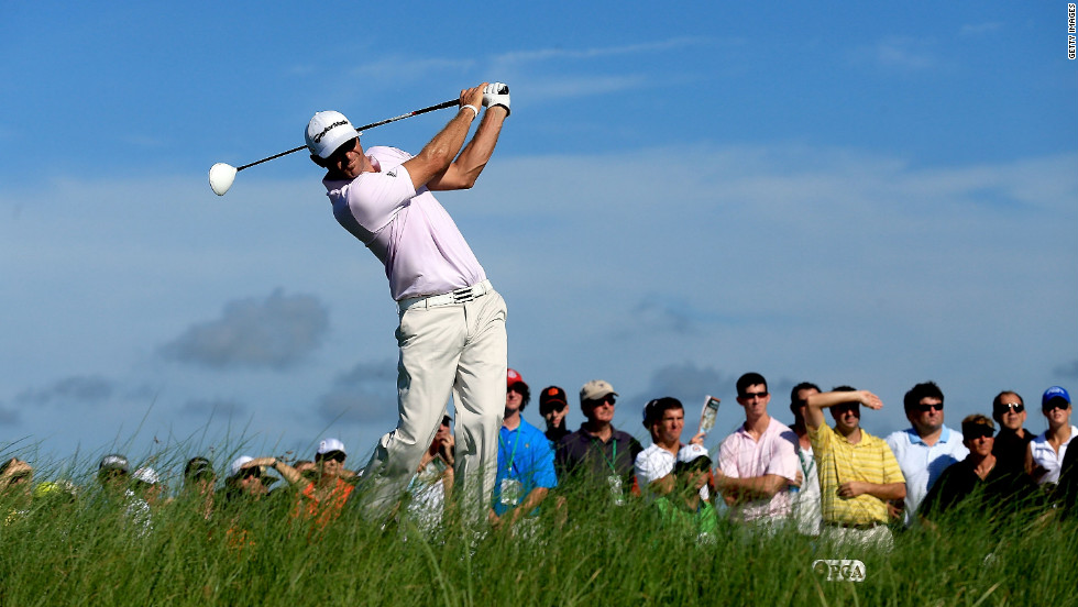 U.S. player Dustin Johnson hits off the 15th tee during the first round of the 94th PGA Championship on Thursday.