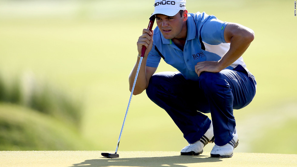 Martin Kaymer of Germany lines up a putt on the 11th green.