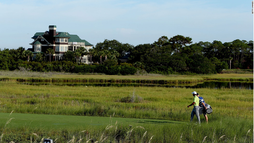 Woods walks toward the 10th fairway.