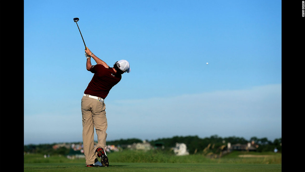 Rory McIlroy of Northern Ireland hits off the 12th tee.