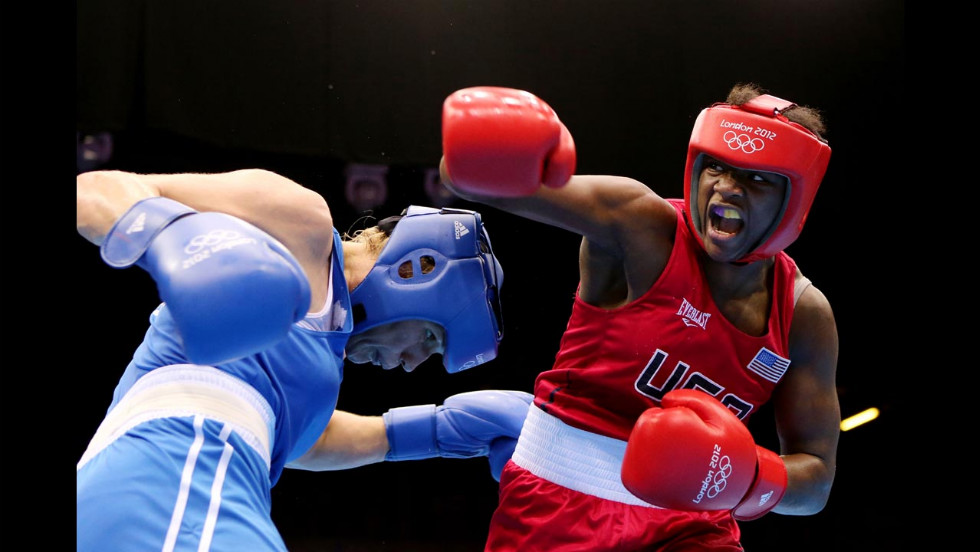 Claressa Shields, in red, battles Nadezda Torlopova of Russia during the women&#39;s middleweight boxing final. Shields defeated Torlopova 19-12 to take the gold, becoming the first U.S. woman to take an Olympic boxing gold. &lt;a href=&quot;http://cnnphotos.blogs.cnn.com/2012/07/20/t-rex-the-youngest-female-olympic-boxer/&quot; target=&quot;_blank&quot;&gt;See more photos of Shields and read her story on CNN&#39;s photo blog&lt;/a&gt;.