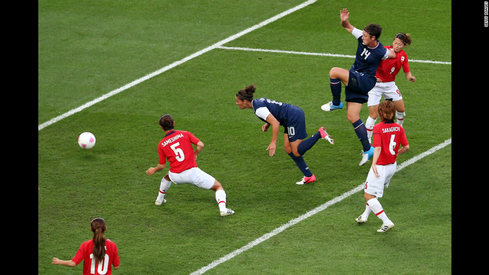 Midfielder Carli Lloyd of the United States heads in a goal in the first half of the game against Japan. The U.S. women&#39;s soccer team took its third straight Olympic gold medal.