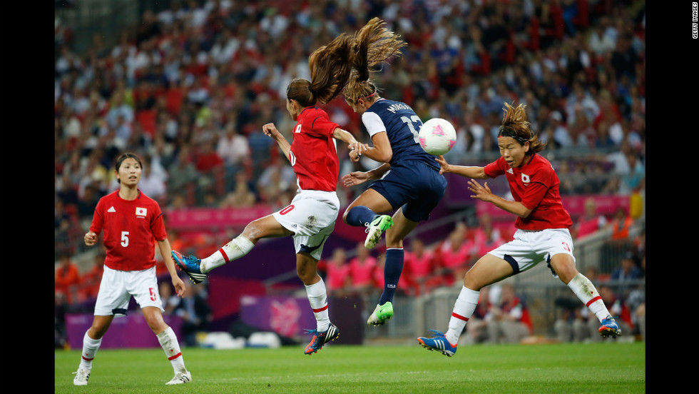 Forward Alex Morgan of the United States battles for the ball during Thursday&#39;s match against Japan.