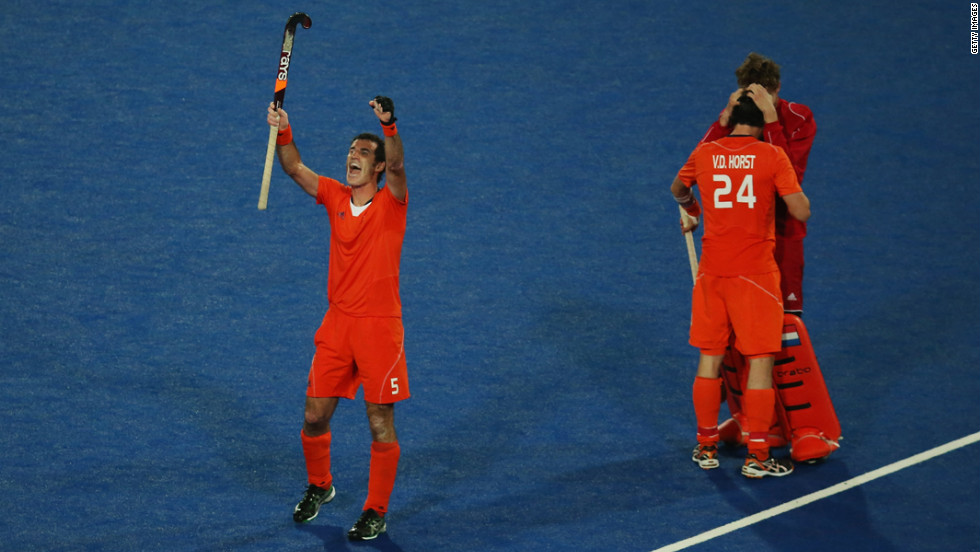 Marcel Balkestein, Robert van der Horst and goalkeeper Jaap Stockman of the Netherlands celebrate victory after the men&#39;s hockey semifinal match between Great Britain and the Netherlands.
