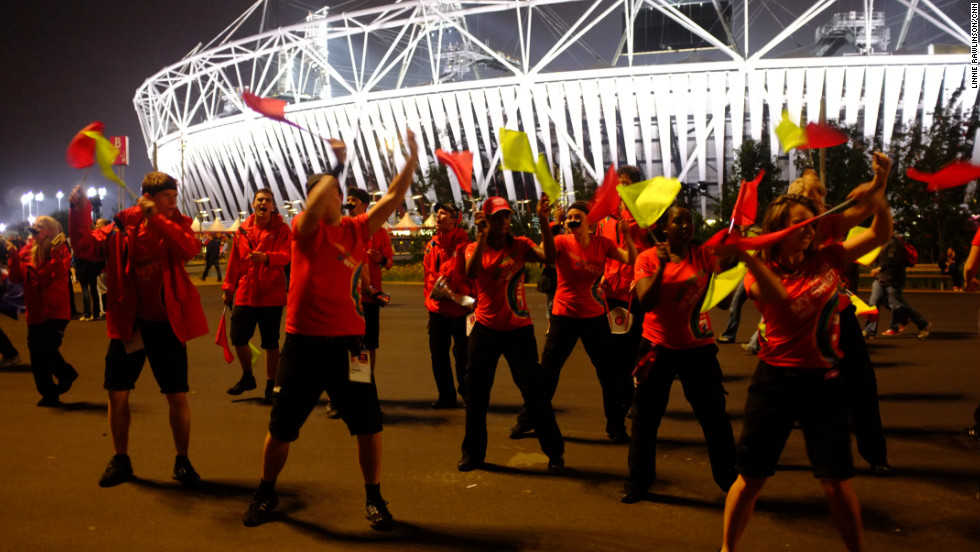 Once the evening&#39;s athletics had finished, crowds poured from the Olympic Stadium. Dancers guided the crowds towards the exits and wished them a safe journey home.