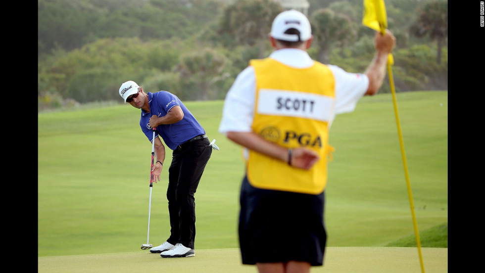 Australia&#39;s Adam Scott putts on the 11th green during the second round of the 94th PGA Championship.