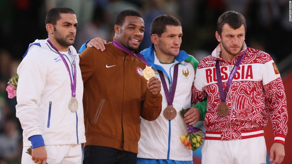 From left to right: Silver medalist Sadegh Saeed Goudarzi of Iran,  gold medalist Jordan Ernest Burroughs of the U.S. and bronze medalists  Soslan Tigiev of Uzbekistan and Denis Tsargush of Russia on the podium of the men&#39;s 74-kilogram freestyle.