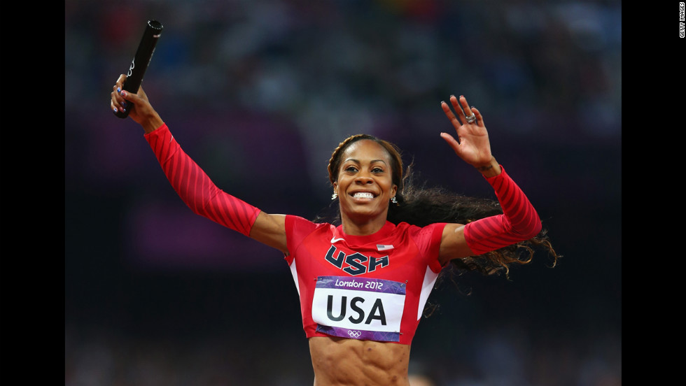 Sanya Richards-Ross of crosses the finish line to win gold for her team.