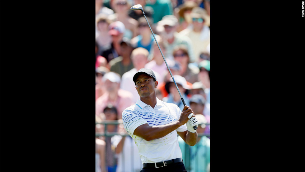 Tiger Woods of the United States hits off the first tee.