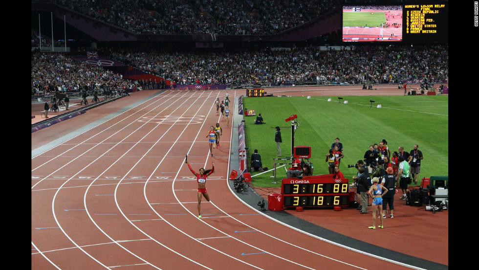 Sanya Richards-Ross of the United States is triumphant as she crosses the finish line.