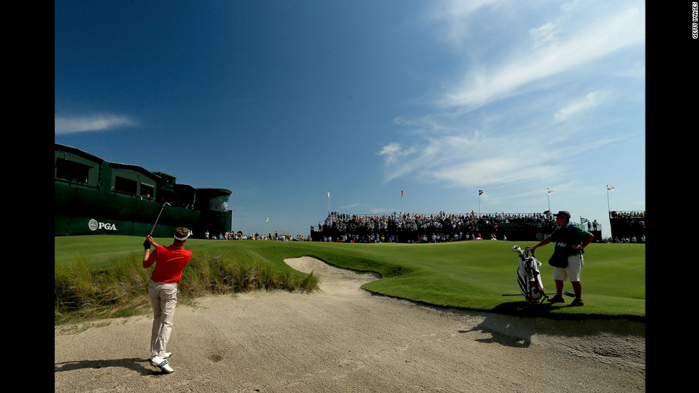 David Lynn of England hits out of the sand on the 18th hole.