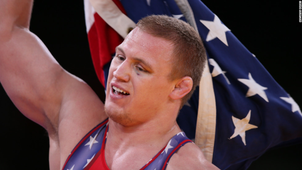 U.S. wrestler Jacob Varner waves the Stars and Stripes after winning the gold medal in the men&#39;s 96-kilogram freestyle event on Sunday, August 12.