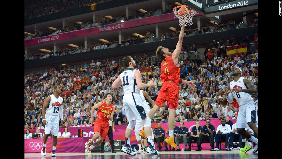 Pau Gasol of Spain drives past Kevin Love of the United States.