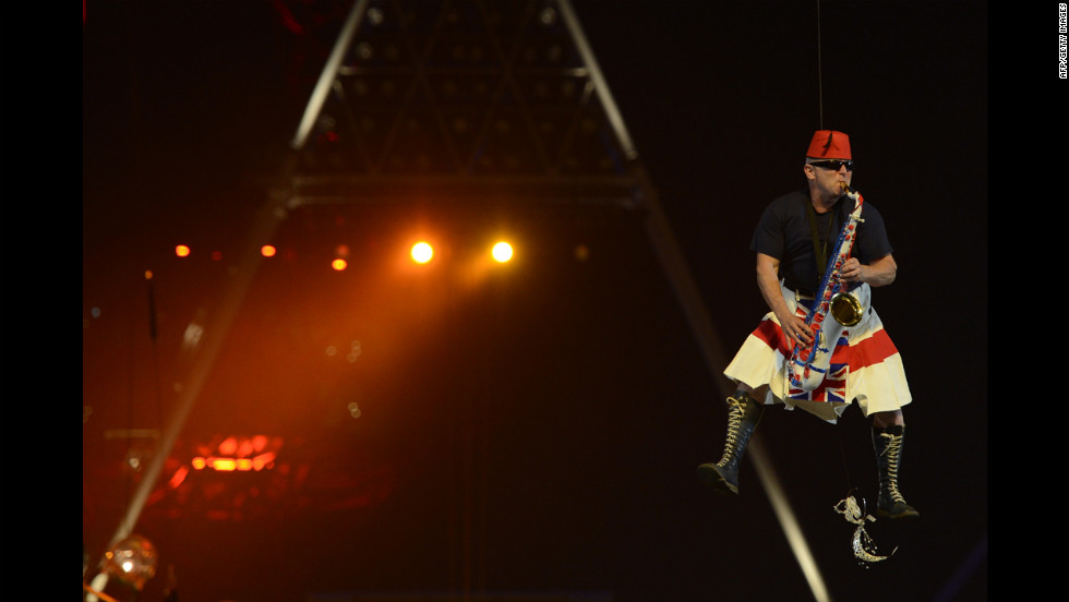 Madness saxophonist Lee Thompson is lifted into the air while playing &quot;Our House,&quot; a reprise of what he did in the video for the song.