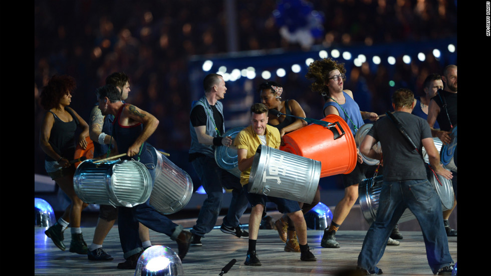 Members of the British percussion group Stomp pound trash cans during their performance.