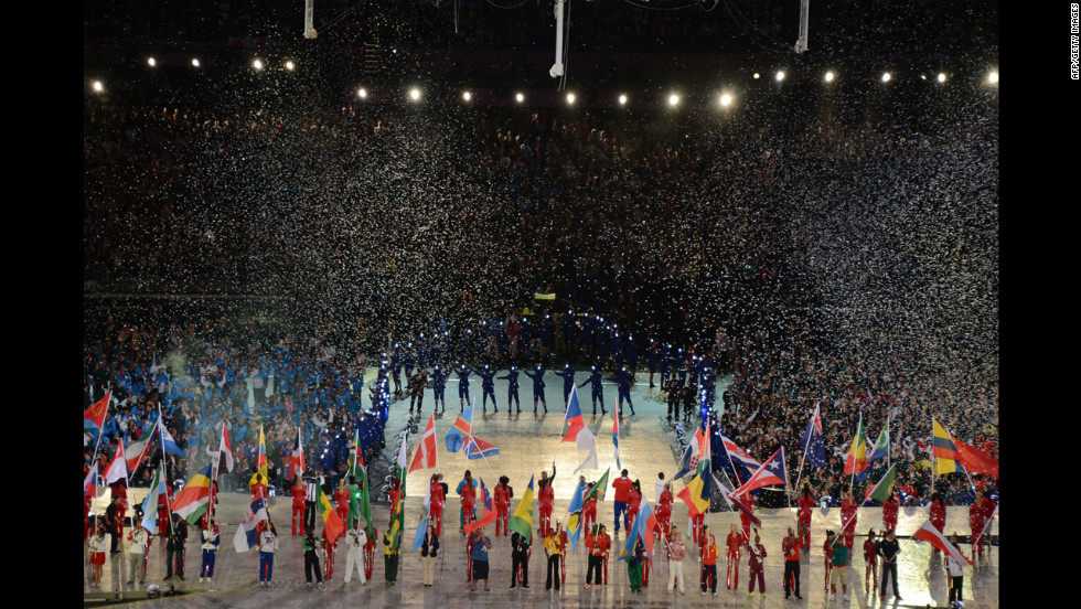 Flagbearers carry the flags of the 204 countries that participated in the Olympics.