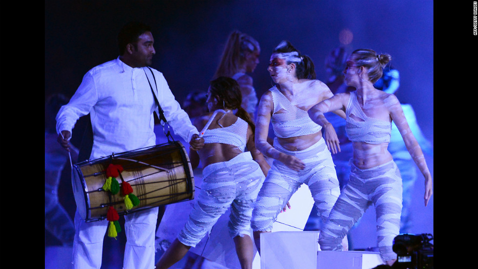 Artists perform at the Olympic stadium.